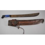 A Mid 20th Century South American Machete in Leather Scabbard, Blade Stamped Columbia