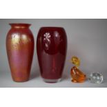 A Large Red Studio Glass Vase Together with a Similar Example and Two Paperweights