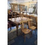 A Modern Rectangular Pine Kitchen Table and Four Chairs, Table 122x92cm