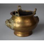 A Chinese Bronze Censer with Temple Lion Mask Decoration and Three Hanging Rings, 10.5cm Diameter