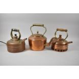 A Collection of Three Various Copper Kettles