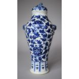 A 19th Century Chinese Blue and White Vase with Lion Mask Handles and Finial to Lid, 27cm high