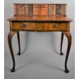 A Reproduction Walnut Carlton House Style Writing Desk with Serpentine Fronts and Raised Back Having