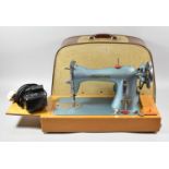 A Vintage Cased Indian Electric Sewing Machine with Foot Pedal