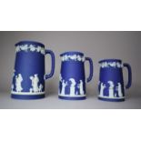 A Graduated Set of Three Wedgwood 19th Century Blue Jasperware Jugs