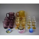 A Collection of Coloured Glassware to Include Aubergine Glass Lemonade Set together with an Amber