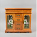 A Modern Jewellery Cabinet with Two Glazed Compartments and Four Centre Drawers Together with a