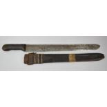 An African Leather Handled Machete in Leather Scabbard