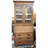 An Edwardian Oak Bureau Bookcase with Fall Front to Fitted Interior, Three Long Drawers to Base,