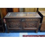 An Early Oak Two Panel Coffer Chest Having Hinged Three Panel Lid, Missing Lock and Later Carving to