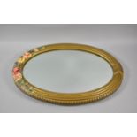 A Mid 20th Century Oval Gilt Framed Wall Mirror, with Flower Garland Moulding 47cm high