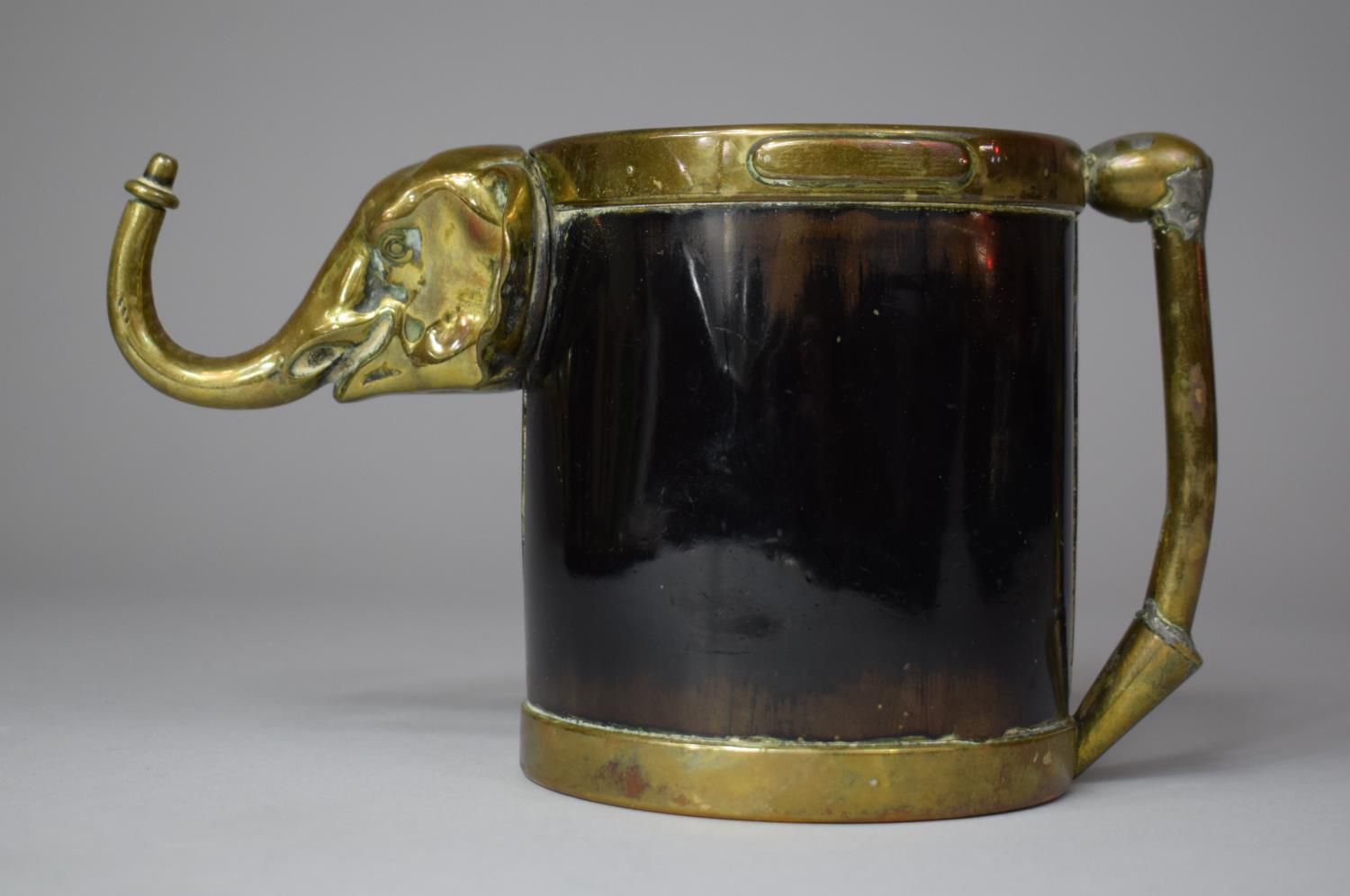 A Colonial Brass and Tortoiseshell Tankard with Glass Bottom and Hanging Hook in the Form of an