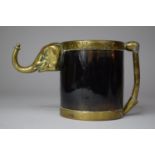 A Colonial Brass and Tortoiseshell Tankard with Glass Bottom and Hanging Hook in the Form of an