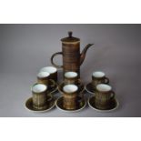 A Stoneware Coffee Set to Comprise Coffee Pot, Six Cans, Saucers and Sugar Bowl
