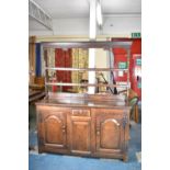 A 19th Century Oak Dresser with Small Centre Drawer and Panelled Doors with Iron H Hinges Either