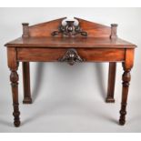 A Mid Victorian Mahogany Buffet or Serving Table with Raised Gallery and Swan Neck Cornice on Turned