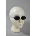 A Pair of Vintage Tinted Glass Snow Goggles