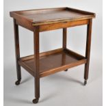 An Edwardian Oak Two Tier Trolley with Lift and Twist Top, 65cm wide