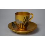 A Japanese Lacquered and Gilt Decorated Cup and Saucer