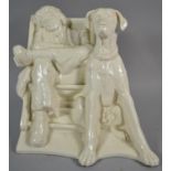 A Glazed Ceramic Study of Great Dane Beside Seated Sleeping Gent, 18cm high