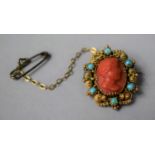 A Victorian Yellow Metal, Coral and Turquoise Cameo Brooch Depicting Young Boy
