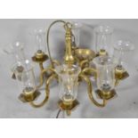 A Brass Eight Branch Ceiling Chandelier with Glass Bell Shaped Shades, 38cm high