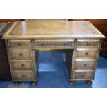 A Mid 20th Century Kneehole Writing Desk with Tooled Leather Top, Three Drawers Under and Three