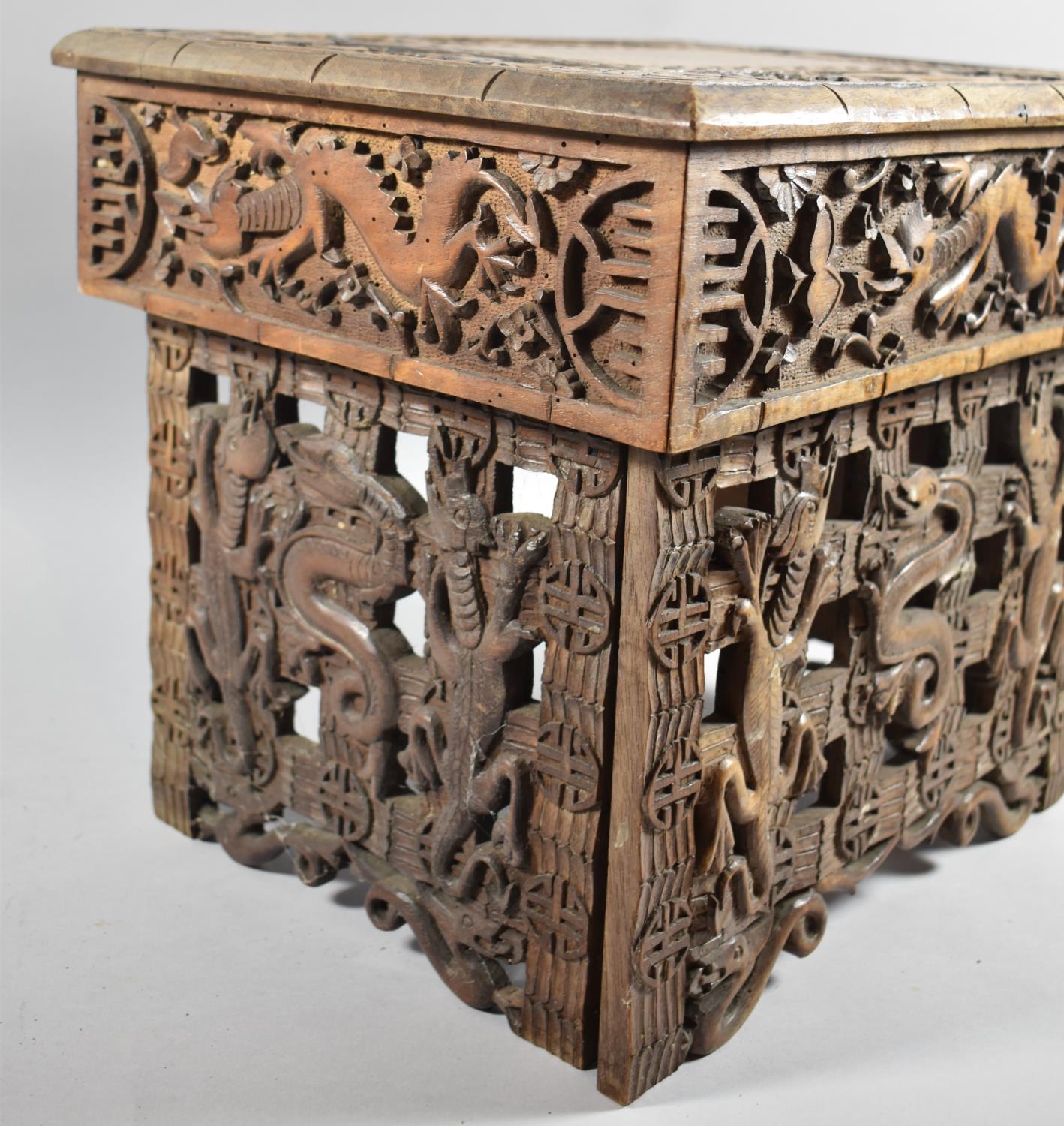 An Interesting Heavily Carved Oriental Folding Box Seat Decorated with Dragons, One Panel Missing - Image 3 of 7