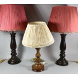 A Pair of Turned Wooden Table Lamps and Shades, 83cm high and a Smaller Example
