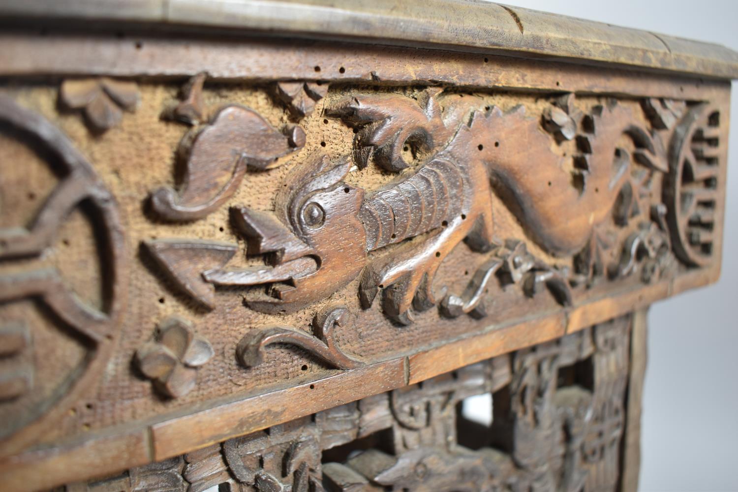 An Interesting Heavily Carved Oriental Folding Box Seat Decorated with Dragons, One Panel Missing - Image 6 of 7