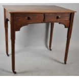 A Teak Two Drawer Side Table on Chamfered Square Supports with Casters, 78cm wide