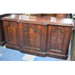 A Late Victorian Mahogany Breakfront Sideboard with Centre Cupboard and Drawers and Slides in