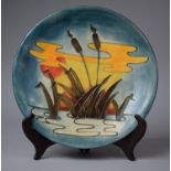 A Moorcroft 'Reeds at Sunset' Plate with Tubelined Decoration, 26cm Diameter