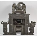A Late 19th Century Cast Iron Pocket Watch Holder in the Form of a Cooking Range, One Side Figure