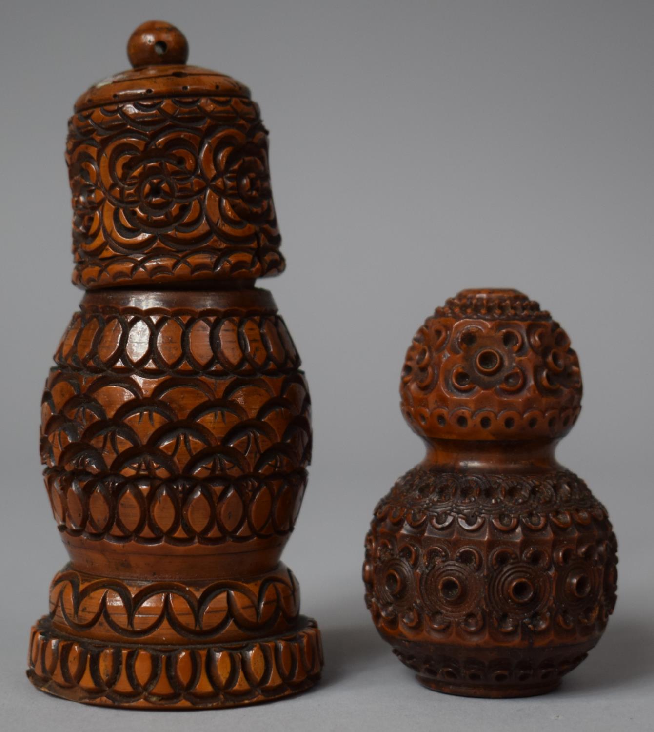 A Small Carved Treen Salt and a Taller Pepper, 10.5cm high