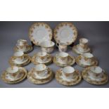 An Edwardian Pattern Tea set to comprise Twelve Cups, Twelve Saucers, Eleven Side Plates, Two Cake