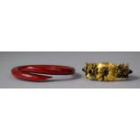 A Vintage Coro Bangle c.1950 and a Red Bakelite Example