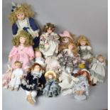 A Collection of Various Modern Porcelain Head Dolls