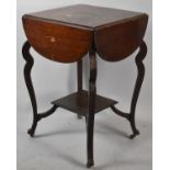 An Edwardian Mahogany Occasional Table with Four Demi Lune Drop Leaves and Square Stretcher Shelf,