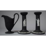 A Pair of Wedgwood Black Jasperware Candle Sticks, 15cm High and a Wedgwood Basalt Jug
