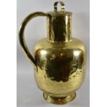 A Large Brass Hand Beaten Water Jug with Lid, Probably Middle Eastern, 61cm high