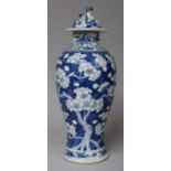 An Oriental Blue and White Prunus Pattern Vase and Cover (Rim Glued), Having Four Character Mark for