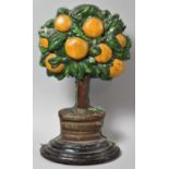 A Heavy Cast Iron Doorstop in the Form of an Orange Tree, 29cm high