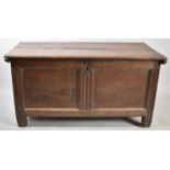 An Early Oak Lift Top Two Panel Coffer Chest, 121cm wide