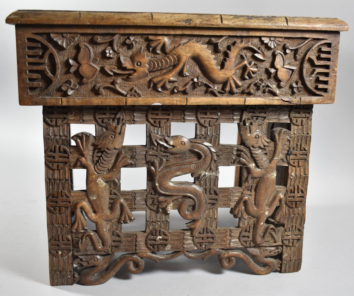 An Interesting Heavily Carved Oriental Folding Box Seat Decorated with Dragons, One Panel Missing - Image 2 of 7