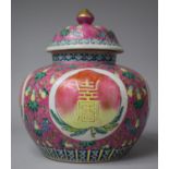 A Nonya Straits Porcelain Pink Ground Jar and Cover Decorated with Peach and Double Happiness