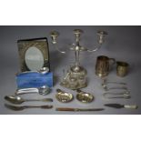 A Collection of Various Metalwares to include Three Branch Candelabra, Soup Spoons, Silver Plated