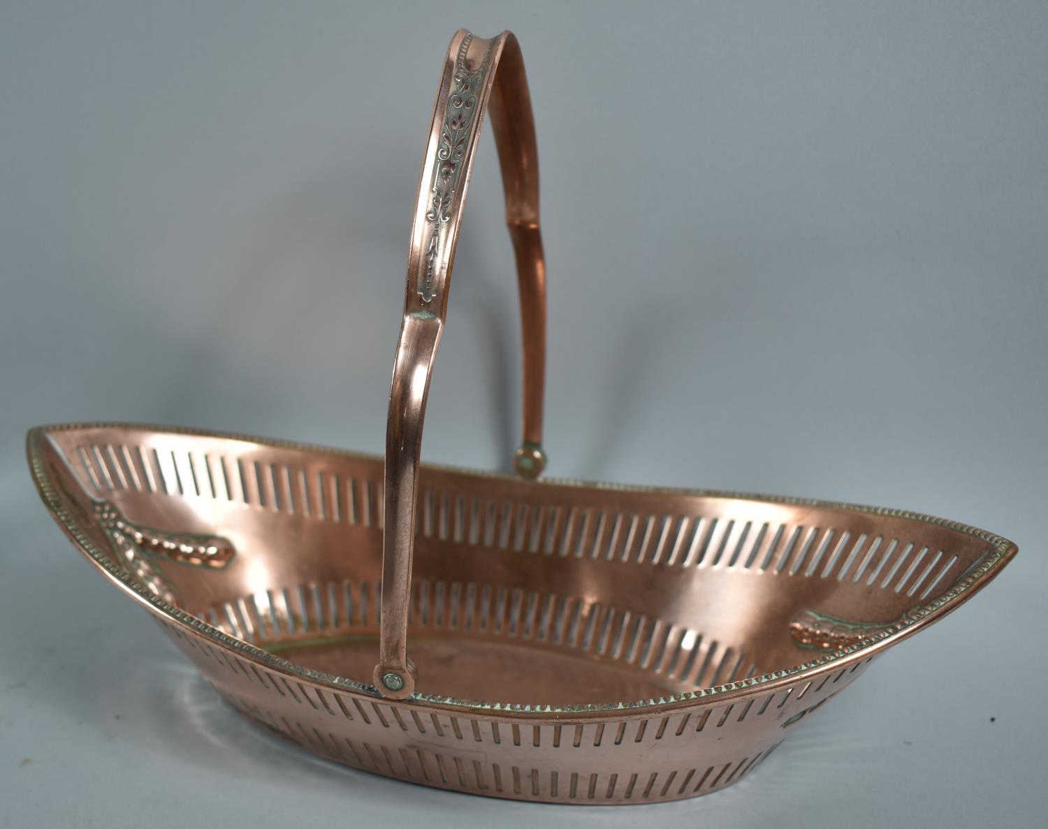 A Former Sheffield Plated Boat Shaped Basket with Pierced side and Swag Decoration, 32.5cm wide