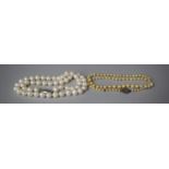 Two Strings of Ivory Coloured Pearls with Silver Clasp