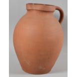 A Large Terracotta Inner Glazed Water Jug, 33cm high